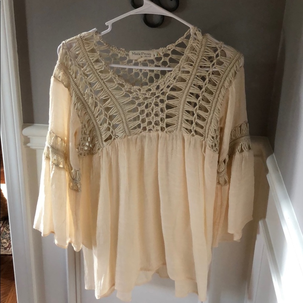 Cream crotchet blouse.